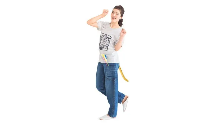A model shows off the jeans with her hands up like a cat.