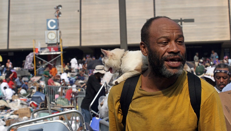 New Orleans, UNITED STATES: Joseph Barnes, 50, and his cat Patches wait to be evacuated from the Superdome in New Orleans 03 September 2005, six days after Hurricane Katrina hit the city. Thousands of soldiers poured into New Orleans 03 September while multitudes fled the city, leaving behind rotting bodies, flooded streets and homes and fears of disease epidemics. AFP PHOTO/Nicholas KAMM (Photo credit should read NICHOLAS KAMM/AFP/Getty Images)