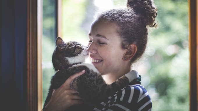 young lady holding cat