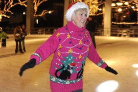 Woman skating with ugly cat sweater