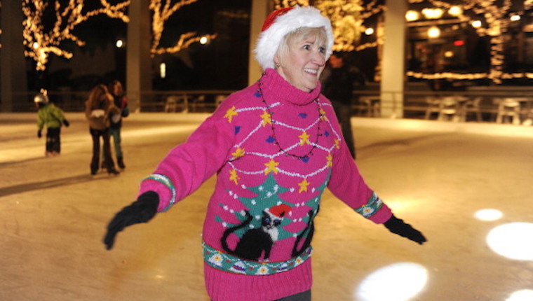 Woman skating with ugly cat sweater