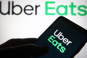 UKRAINE - 2021/06/04: In this photo illustration, Uber Eats logo of a US online food ordering and delivery platform is seen on a smartphone in a hand.