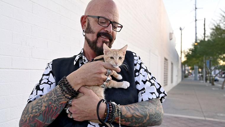 LAS VEGAS, NEVADA - NOVEMBER 07: Television personality Jackson Galaxy from Animal Planet's "My Cat From Hell" poses with Bonni, a four-month-old domestic shorthair orange tabby cat before an unveiling and rededication of an artwork titled, "Snowball in Vegas," during a ceremony in which the city of Las Vegas proclaimed Thursday "Cat Appreciation Day" on November 7, 2019 in Las Vegas, Nevada. 