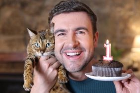 man celebrating cats first birthday codependent with cat
