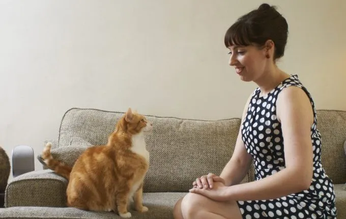 woman in vintage dress with cat old-fashioned cat names