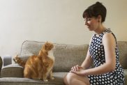 woman in vintage dress with cat old-fashioned cat names