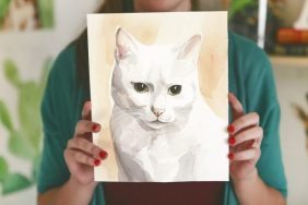 woman holding custom cat portrait